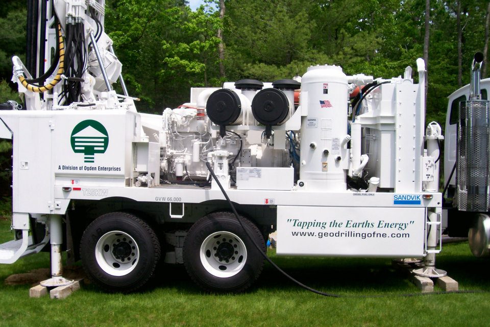 Ogden Wells rotary drilling rig operating on a residential property in Massachusetts
